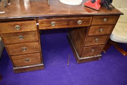 A Victorian pedestal desk having inlayed mahogany carcass