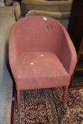 A vintage woven fibre tubchair
