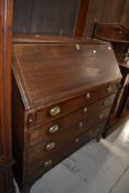 A 19th Century and later mahogany bureau having inlay decoration to flap, brass handles and