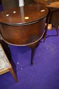 An Edwardian haberdashery case having fitted interior with contents including buttons and sewing