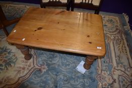 A modern yellow pine coffee or low table
