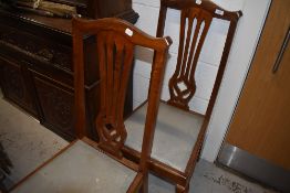 A pair of mahogany carved back dining chairs having cabriole legs