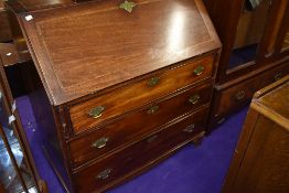An Victorian bureau having three drawer set and fitted interior with mahogany frontage