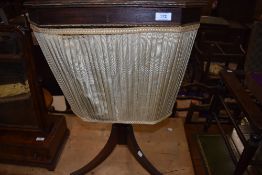 A Victorian sewing or haberdashery table stand on tripod base with mahogany and rose wood carcass