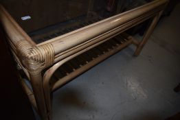 A canework and glass top coffee table