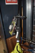 A Ryobi petrol strimmer, with packet of cord