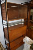 A vintage ladderax unit having glazed and bureau sections, wooden and glass shelf
