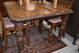A Victorian oak dining table (previously being windout but no central leaf) having extensively