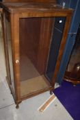 An art deco display cabinet having glazed frontage