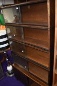 A vintage simplex stacking bookcase, 5 tiers in total, dark colour