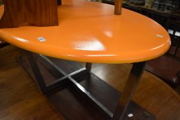 A mid century coffee table having chrome base