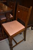 A set of four part oak vintage dining chairs