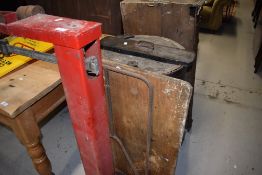 A vintage platform scale and large metal barrel