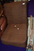 A vintage mid century modern low seat nursing chair