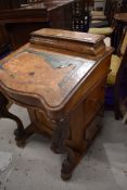 A davenport desk having burr wood veneer carved supports and side drawer set