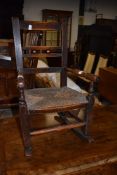 A period oak child's rocking chair