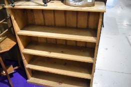 A modern yellow pine set of book shelves