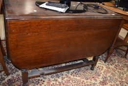An early 20th Century oak gateleg table, width approx. 96cm