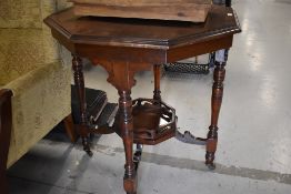 A Victorian mahogany occasional table having octagonal top and galleried undertier