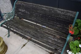 A vintage garden bench having cast ends