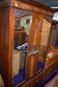 A Victorian mirror door wardrobe