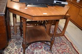 A late Victorian mahogany octagonal occasional table having undertier, on turned legs and cross