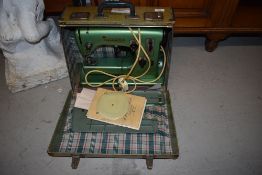 A vintage Viking sewing machine and carry case