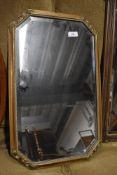 A vintage gilt frame wall mirror, labelled for Boots