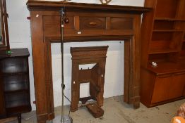 An early 20th Century mahogany fire surround, mantel width approx. 153cm and a traditional cast iron