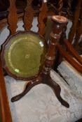 A reproduction mahogany wine table having shaped top