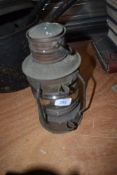 A vintage nautical lamp labelled 'Anchor'.