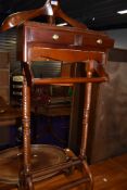 A reproduction hardwood valet