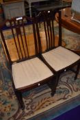 A pair of Edwardian mahogany salon or bedroom chairs