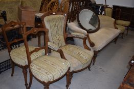 A Victorian mahogany framed salon suite comprising scroll arm, settee and two easy chairs, and