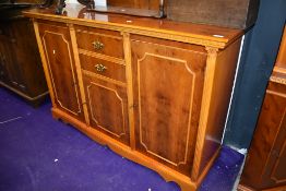 A modern yew wood sideboard or cocktail cabinet 5ft long