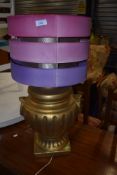 A large gilt effect table lamp