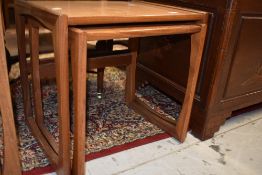A vintage teak part nest of tables, stained to tops
