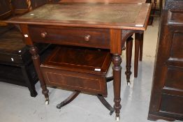A Victorian mahogany writing table having crocodile effect/leather inset top, single frieze drawer