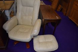 A modern reclining arm chair and matching stool in a stressless style