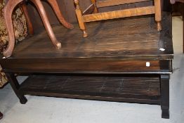 An Oriental style coffee table having bamboo centre and undertier, approx. 120 x 68cm