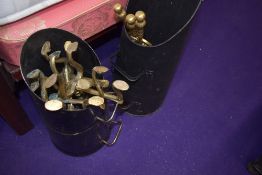 Two coal buckets and a collection of fire side brass ware.