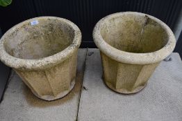 A pair of vintage stone effect garden planters