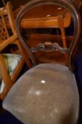 A Victorian balloon back dining chair with mahogany frame