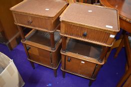 A pair of late art deco bedside cabinets or cupboards