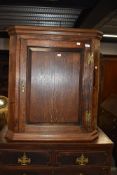 A 19th Century oak corner cupboard, height approx. 84cm