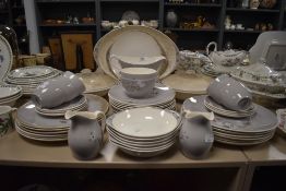 An extensive collection of Royal Doulton frost pine including cups and saucer, bowls and more.