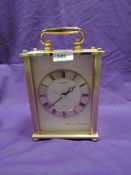 A seiko brass effect mantel clock
