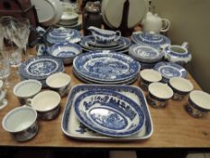 A good selection of blue and white willow wear dinner and tea wears including Royal Tudor wear