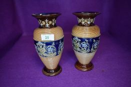 A Doulton Lambeth vase having blue and brown ground with floral decoration and similar AF