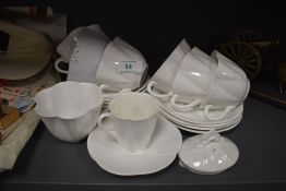 A selection of tea cups and saucers by Shelley in the Dainty white design
